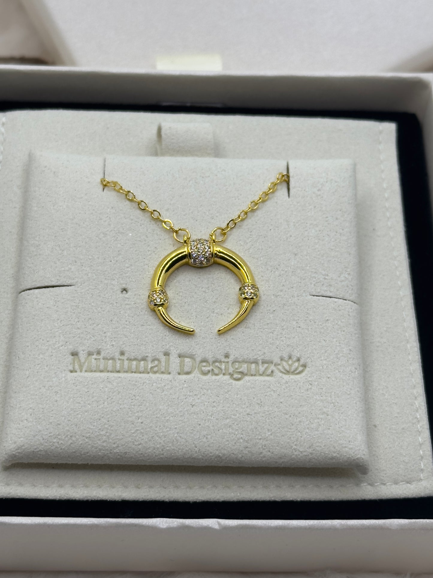 Half moon 18k gold plated gold necklace with rhinestones and beige pouch